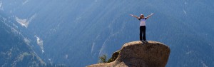 Woman Standing on Rock