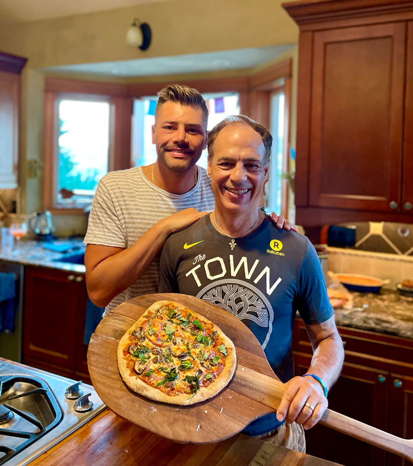  Donnie Yance in his Golden State Warriors shirt with his cousin Emil making homemade whole-grain pizza—yum! 