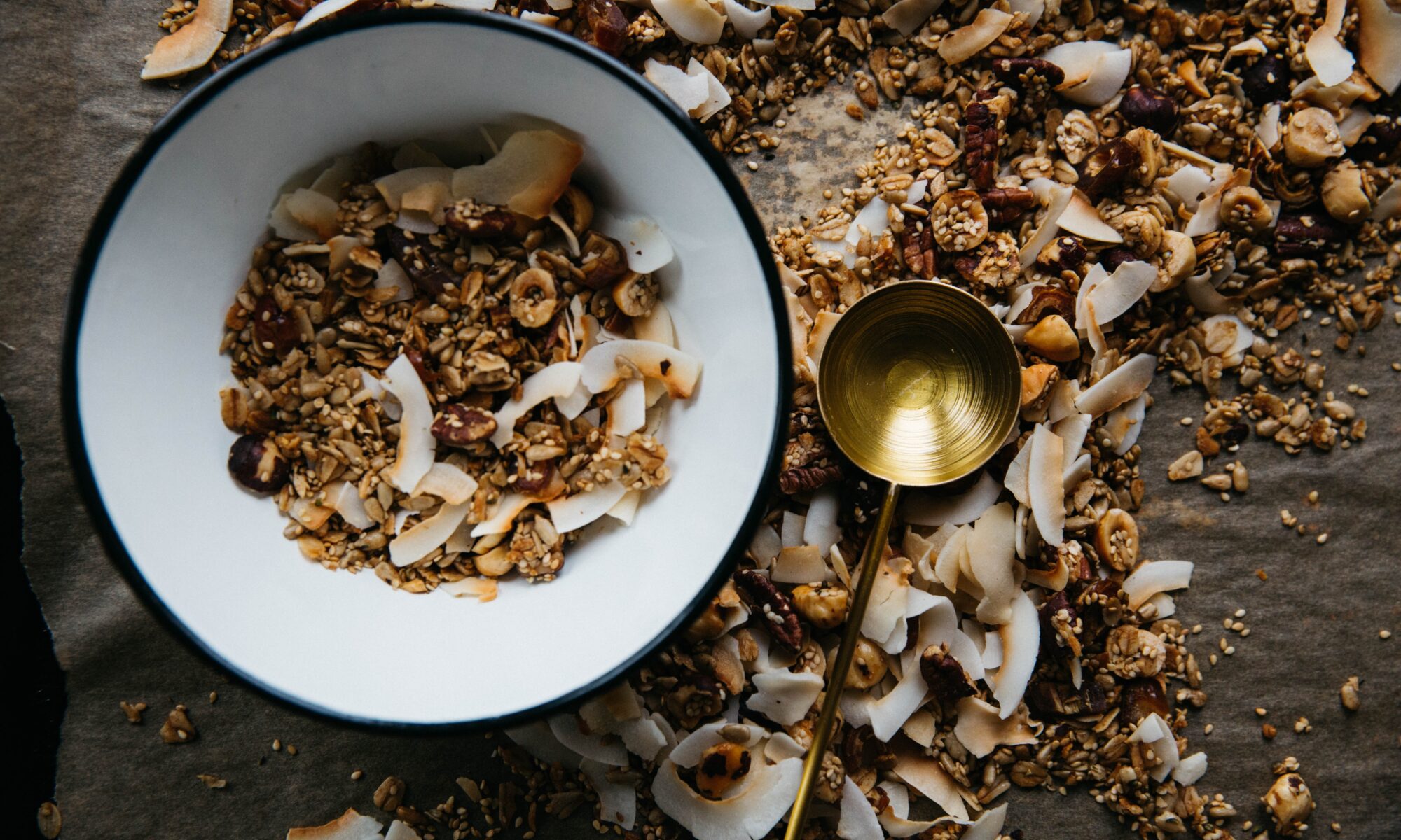 bowl of whole grains next to golden ladle