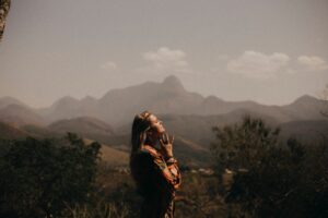 A woman looking hopefully into the sky